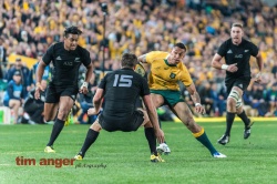 Wallabies' full back, Isreal Folau, attempts to step around his opposite number, Ben Smith.
