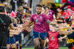 Samu Kerevi leads the REds out in their one-off retro jersey